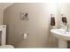 Powder room with pedestal sink and nautical decor at 10214 Post Harvest Dr, Riverview, FL 33578