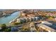 Aerial view of a waterfront neighborhood featuring multiple condo buildings and boat docks at 1100 Pinellas Bayway S # H2, Tierra Verde, FL 33715