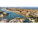 Waterfront community with boat docks, showcasing beautiful homes and lush landscaping along the tranquil waterways at 1100 Pinellas Bayway S # H2, Tierra Verde, FL 33715