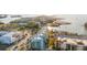 Aerial view showcasing condos with boat docks and access to beautiful beach and parking at 1100 Pinellas Bayway S # H2, Tierra Verde, FL 33715