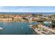 Breathtaking aerial view of waterfront properties with docks, boats, sandy beaches, and a serene coastal atmosphere at 1100 Pinellas Bayway S # H2, Tierra Verde, FL 33715