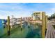 View of the water and condo from the dock with space to park and maintain your boat at 1100 Pinellas Bayway S # H2, Tierra Verde, FL 33715