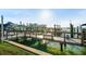 A wooden dock extends into the waterway, offering boat access and waterfront views at 1100 Pinellas Bayway S # H2, Tierra Verde, FL 33715