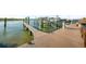 A weathered wooden dock offers stunning views of the serene water and sky at 1100 Pinellas Bayway S # H2, Tierra Verde, FL 33715