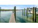 This dock offers direct access to the water and the boats docked to the right at 1100 Pinellas Bayway S # H2, Tierra Verde, FL 33715