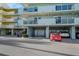 Exterior of the building showing balconies with garage parking underneath at 1100 Pinellas Bayway S # H2, Tierra Verde, FL 33715