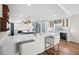 Open concept kitchen featuring a bar area with counter seating and appliances at 1100 Pinellas Bayway S # H2, Tierra Verde, FL 33715