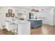 Spacious kitchen with a breakfast bar and center island, perfect for gatherings at 1100 Pinellas Bayway S # H2, Tierra Verde, FL 33715