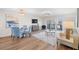 Bright living space with dining area, modern furniture, and natural light at 1100 Pinellas Bayway S # H2, Tierra Verde, FL 33715