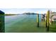 Water view featuring dock pilings and neighborhood at 1100 Pinellas Bayway S # H2, Tierra Verde, FL 33715