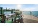 Waterfront dock offers outdoor seating, fish cleaning station, and stunning ocean views at 1100 Pinellas Bayway S # H2, Tierra Verde, FL 33715