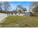 Backyard with a well manicured lawn and privacy fence at 1103 E Louisiana Ave, Tampa, FL 33603