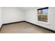 Bedroom with sleek wood floors and a bright window at 1103 E Louisiana Ave, Tampa, FL 33603