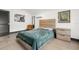 Cozy bedroom with hardwood floors, natural light, and neutral decor at 1103 E Louisiana Ave, Tampa, FL 33603