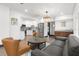 Open-concept living area showcasing a modern kitchen, elegant lighting, and stylish furnishings at 1103 E Louisiana Ave, Tampa, FL 33603
