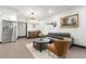 Relaxing living space showcasing a modern kitchen, ample natural light and comfortable seating at 1103 E Louisiana Ave, Tampa, FL 33603