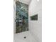 Close up of shower with hexagon tile and accent designer tile at 1103 E Louisiana Ave, Tampa, FL 33603