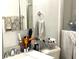 Functional bathroom with vanity, sink, toilet, and a shower at 1109 Pine Ridge W Cir # F1, Tarpon Springs, FL 34688