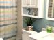 Bathroom featuring a toilet, sink, vanity, cabinet, and decorative items at 1109 Pine Ridge W Cir # F1, Tarpon Springs, FL 34688