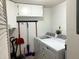 Bright laundry room with washer, dryer, and ample storage at 1109 Pine Ridge W Cir # F1, Tarpon Springs, FL 34688
