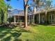 Spacious backyard featuring an in-ground pool with screened enclosure offering a private outdoor oasis at 12010 Hardaman Pl, Tampa, FL 33618