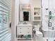 Beautifully remodeled bathroom featuring marble countertop, vanity, and walk-in shower at 12010 Hardaman Pl, Tampa, FL 33618