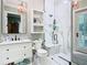 Modern bathroom features a glass-enclosed shower, marble finishes, and stylish fixtures at 12010 Hardaman Pl, Tampa, FL 33618