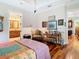 Comfortable bedroom featuring a desk area, hardwood floors, and cozy furniture at 12010 Hardaman Pl, Tampa, FL 33618