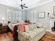 Cozy bedroom with floral accents, ample natural light, and hardwood floors at 12010 Hardaman Pl, Tampa, FL 33618