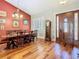 Elegant dining room showcases a wood table and hardwood floors, bathed in natural light at 12010 Hardaman Pl, Tampa, FL 33618