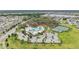 Stunning aerial view of community amenities, pool, clubhouse, tennis courts and lush landscaping at 13176 Twin Bridges Dr, Riverview, FL 33579