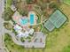 Amazing aerial view of community pool, tennis courts, clubhouse, and parking at 13176 Twin Bridges Dr, Riverview, FL 33579