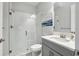 Well-lit bathroom featuring a glass shower, single sink vanity, and neutral decor at 13176 Twin Bridges Dr, Riverview, FL 33579