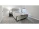 Calming bedroom with large window and neutral decor at 13176 Twin Bridges Dr, Riverview, FL 33579