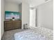 Cozy bedroom with a dresser, television, and adjoining bathroom at 13176 Twin Bridges Dr, Riverview, FL 33579