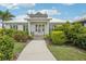 Exterior view of community fitness center with lush landscaping and ample natural light at 13176 Twin Bridges Dr, Riverview, FL 33579