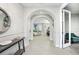 Bright foyer with arched doorways leading to the living areas, and a decorative console table at 13176 Twin Bridges Dr, Riverview, FL 33579