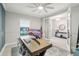 Cozy home office with natural light, a large desk, and French doors that lead to another room at 13176 Twin Bridges Dr, Riverview, FL 33579