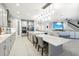 Open concept kitchen with stainless steel appliances, large center island and modern lighting, perfect for entertaining at 13176 Twin Bridges Dr, Riverview, FL 33579