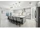 A modern kitchen features a large island, stainless steel appliances, and plenty of natural light at 13176 Twin Bridges Dr, Riverview, FL 33579
