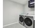 Efficient laundry room features modern appliances for a seamless and convenient chore experience at 13176 Twin Bridges Dr, Riverview, FL 33579