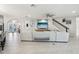 Spacious living room featuring stylish furniture, white tile floors, and modern decor at 13176 Twin Bridges Dr, Riverview, FL 33579