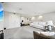 Spacious living area with light colored walls, large storage closet, and a plush white sofa at 13176 Twin Bridges Dr, Riverview, FL 33579