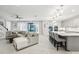 Spacious living room flows into a modern kitchen with a large center island and an open floor plan at 13176 Twin Bridges Dr, Riverview, FL 33579