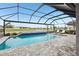 Inviting screened-in pool overlooks the landscaped backyard and serene community at 13176 Twin Bridges Dr, Riverview, FL 33579