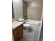 The bathroom features a bathtub, shower, and a vanity with a sink at 1525 Kestrel Way, Brandon, FL 33511