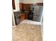 Well-equipped kitchen with stainless steel appliances, wooden cabinets, and granite countertops at 1525 Kestrel Way, Brandon, FL 33511