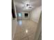 Spacious living room with tile flooring, ceiling fan, and large windows offering abundant natural light at 1525 Kestrel Way, Brandon, FL 33511