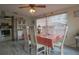 Comfortable dining room featuring tile floors and a large window at 1623 Dartmouth Dr, Holiday, FL 34691