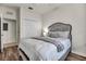 Comfortable bedroom featuring a queen bed, hardwood floors, and an adjacent closet at 17724 Gawthrop Dr # 402, Bradenton, FL 34211